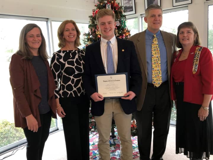 John Lochtefeld receives the award from Darien&#x27;s Good Wife&#x27;s River Chapter DAR Good Citizen Chairperson Kim Kiner as his parents, Nancy and father Tom, and DAR Good Good Wife&#x27;s River Chapter Regent, Katherine Love look on.