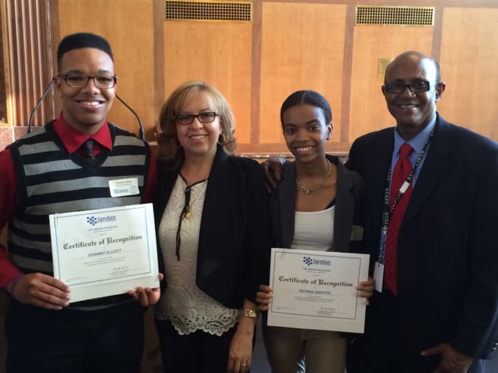 Jovanny Elliot and Keyana Griffith holding their certificates of recognition with PHS college resource advisor Maria Gordineer and assistant principal Kent Picou at an award ceremony in White Plains.