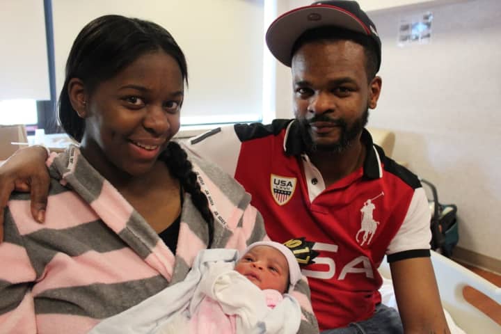 Shatya Tolliver and Elvin Selman hold their newborn, Kamyah Selman, at Vassar Brothers Medical Center in Poughkeepsie. The baby was the first born in Dutchess County in 2017.