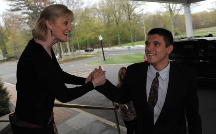 Kathy Vuoncino, the director of Region III special education, welcomes Thomas Dunn to last year&#x27;s Valley Program Prom.