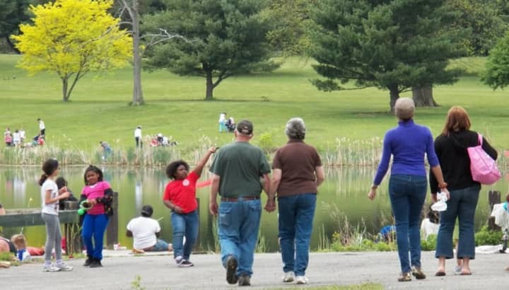 Ken Rose, and his wife, Cheryl, hold hands as they walk toward Morgan Lake in Poughkeepsie where his annual &quot;Get Hooked on Fishing&quot; program was taking place. The photo was taken in 2012.