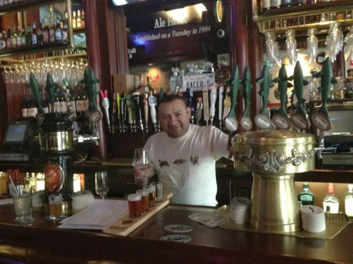 A bartender at the Lazy Boy Saloon in White Plains prepares a beer flight.