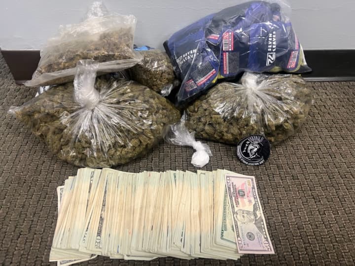 The drugs and cash found during a search of the car.