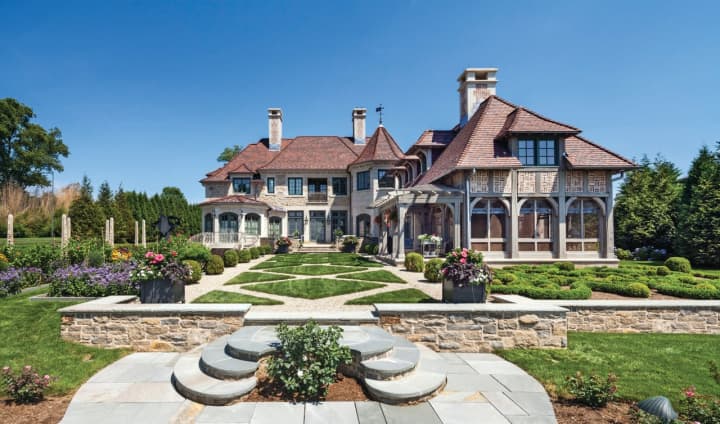Douglas VanderHorn’s award-winning 10,400-square-foot French Eclectic home, is a beautiful waterfront sanctuary surrounded by evergreens and opening toward Long Island Sound.