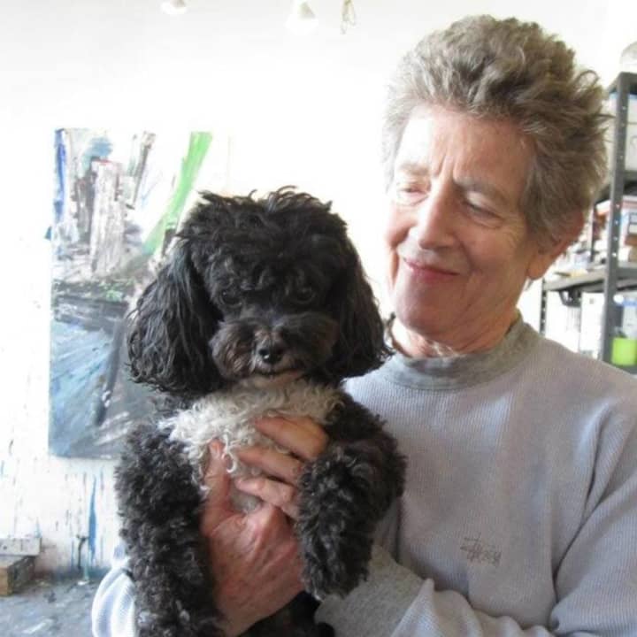 Artist Louise Fishman with her poodle Sammy Sosa.