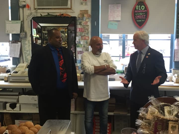 Joe DiMauro (c), owner of Mount Kisco Seafood with County Legislator Francis Corcoran (l) and Michael Jefferson. (r)