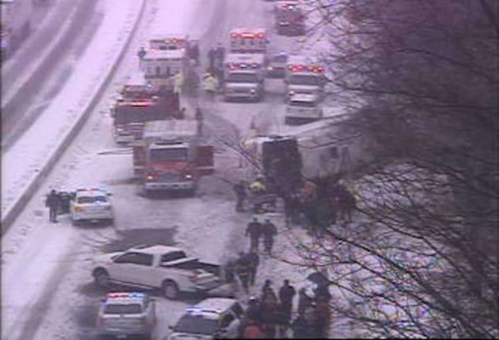 A charter bus has rolled over on northbound I-95 near Exit 61 in Madison, east of New Haven.