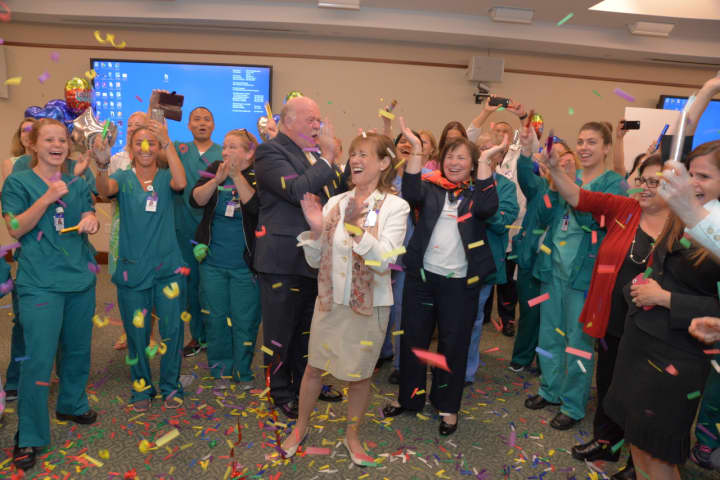 Greenwich Hospital staff join Norman G. Roth, the hospital&#x27;s president, Sue Brown, executive vice president of Operations and Patient Care Services and Magnet Program Director Priscilla Stone to celebrate the hospital&#x27;s Magnet designation.