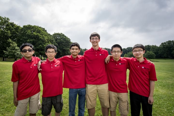 Michael Kural, right of center, with his teammates on the U.S. Math Team.