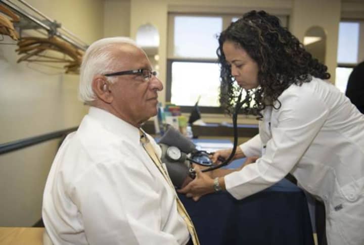 Lyndhurst Mayor Robert B. Giangeruso took a moment to have his blood pressure checked by Nurse Practitioner Faith Fajarito