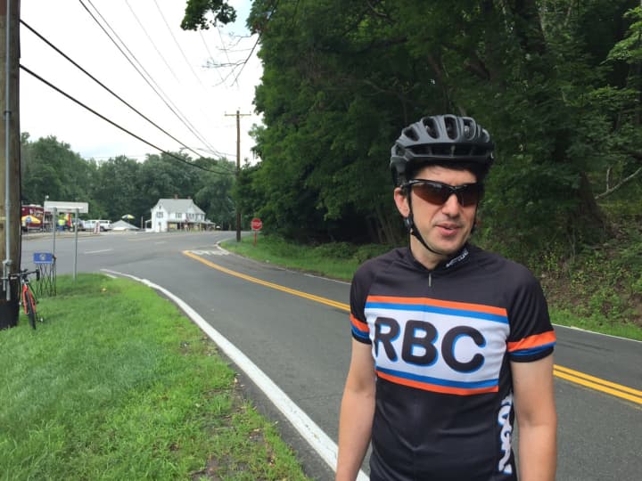 Michael Benowitz, president of the Rockland Bicycling Club, stands on Greenbush Road in Blauvelt. A bike bypass connecting the northern and southern portions of Greenbush will be built behind him.