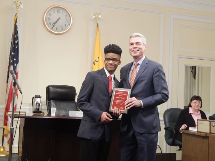Michael Hunter receiving his Youth of the Year award from White Plains Mayor Thomas Roach.