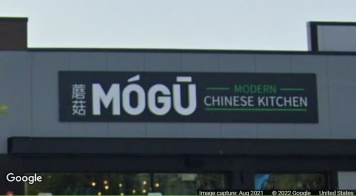 The MÓGŪ Modern Chinese Kitchen sign in Farmingdale
