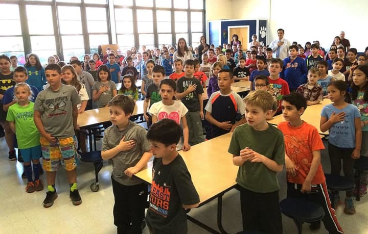 Columbus Elementary School students record the Pledge of Allegiance in Mount Pleasant.