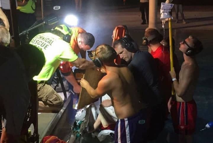 Valhalla firefighters and other rescue crews cut a section of the Mount Pleasant Town Pool wall Wednesday to free a boy whose finger had gotten stuck in a drain