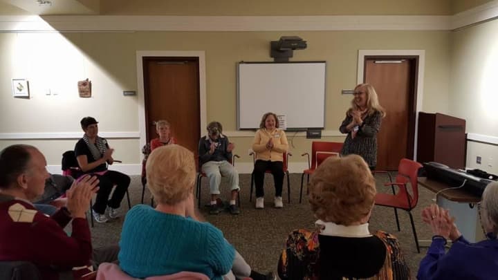 Certified Music Therapist Melinda Burgard leads a rhythmic clapping activity during a recent Music Social Program at the Albert Wisner Public Library in Warwick.