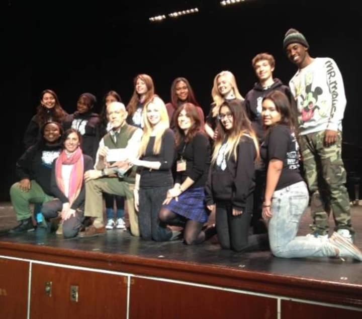 Michael Shannon (front row) presents a scholarship award to an Englewood Idol contestant. 