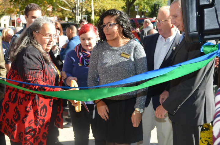 Naugatuck Valley Community College President Daisy Cocco De Filippis takes the lead in the ribbon-cutting ceremony for the new campus in Danbury.