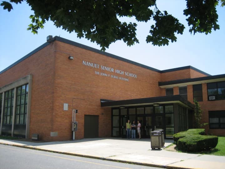 A Nanuet High School student was approached by a pair in a white school bus.