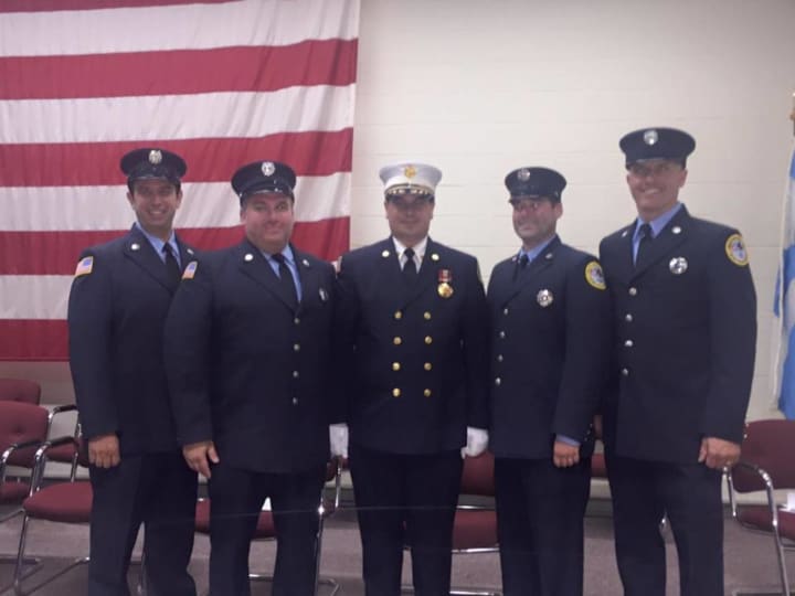 The four newest members of the New City Fire Department were honored by Fire Chief Dennis Rodriguez during a ceremony Thursday night. From left to right: Jack Holden, Marc Ackerman, Rodriguez, Mike Krychear and Jim Morris.