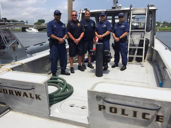 Coast Guard officers are: Andrew Reyes, left; Christopher Azzollini, second from right, and Henry Plante, right. Members of the city&#x27;s Marine Unite are: police Sgt. Pete Lapak, second from left; and Officer Rich Delallo, center.