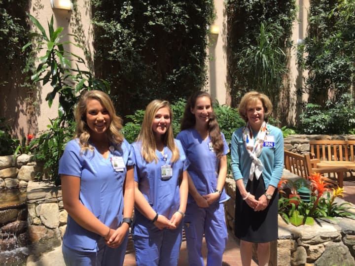(From left): Nursing students Alexandra Maravic of Whitehouse Station, N.J., Samantha Haug of Kinnelon, N.J., and Katie Grosso of Stamford with Ellen Komar, RN, Vice President of Patient Care Services and Chief Nursing Officer at Stamford Hospital.