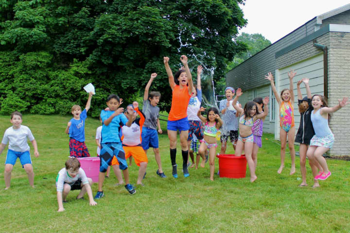 Our Montessori School Juniors and Seniors celebrate the start of summer in Yorktown at Field Day.