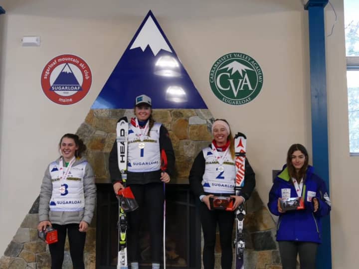 Greenwich resident Olivia Holm, center, earned the title of Overall U16 National Champion at the U.S. Ski and Snowboard Association’s U16 Championships.