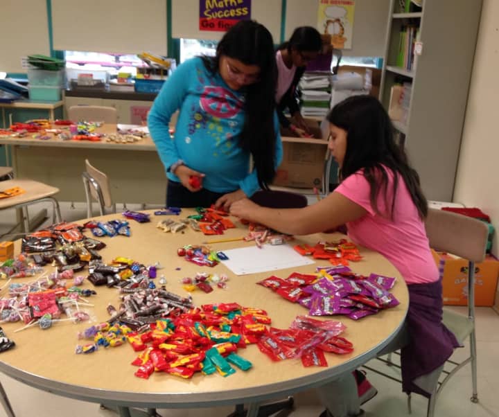 Elmsford students collected candy for veterans after Halloween -- and put their math skills to work.