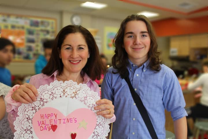 Seventh-grader Ty Amsterdam with his teacher Ilana Brennan. Ty came up with the idea for Pocantico Hills students crafting valentines last week for residents of Atria Briarcliff Manor.