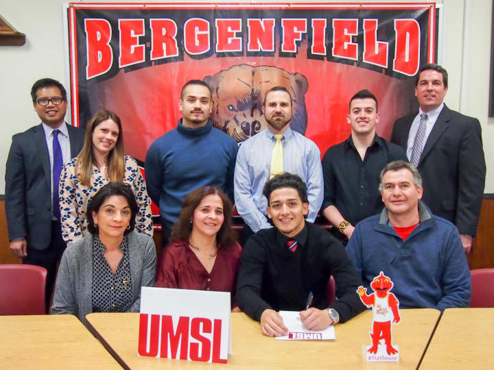 Bergenfield High School senior Kevin Ordonez signs his commitment to the University of Missouri at St. Louis.