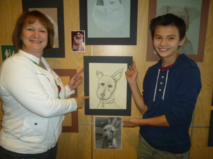 Henry H. Wells Middle School art students donated to the Wounded Warrior Project with money raised selling pet portraits.