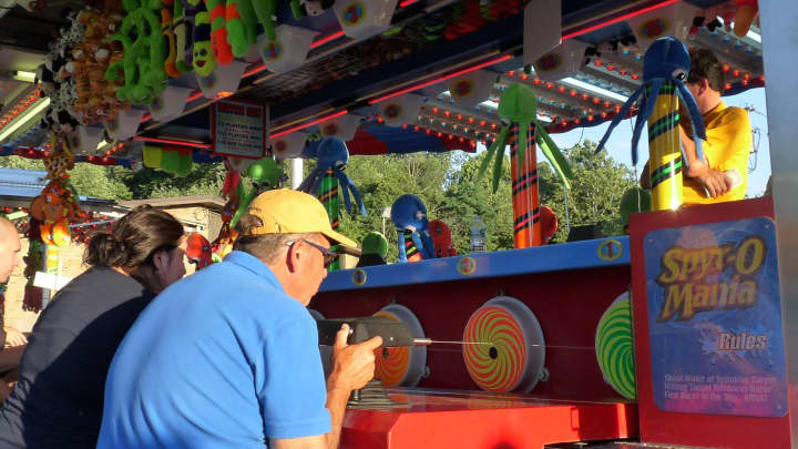 A carnivalgoer playing Spyr-O-Mania at last year&#x27;s Family Days Carnival.