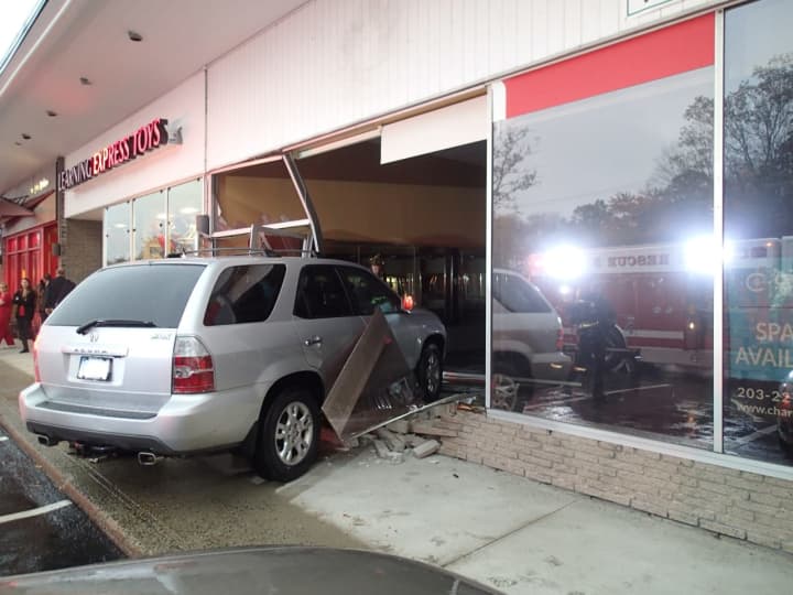 An SUV crashed into a Post Road East storefront.