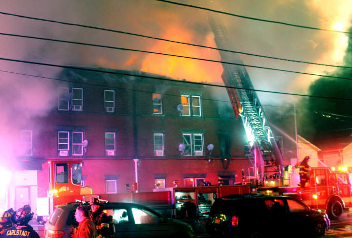 Gas initially fed the flames that raced up through the building on Hamilton Avenue in Passaic.