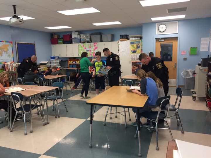Students at the Pierre Van Cortlandt Middle School in Croton-on-Hudson take part in a  &quot;Mannequin Challenge&quot; to illustrate acts of kindness. They were helped out by D.A.R.E. officer Robert Leonard and two of his colleagues.