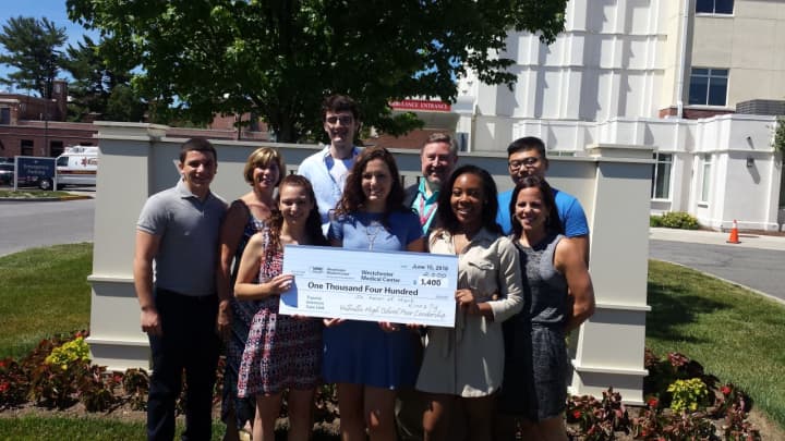 Valhalla High School&#x27;s Peer Leadership Club members with $2000 check it donated to the Maria Ferari Children&#x27;s Hospital.