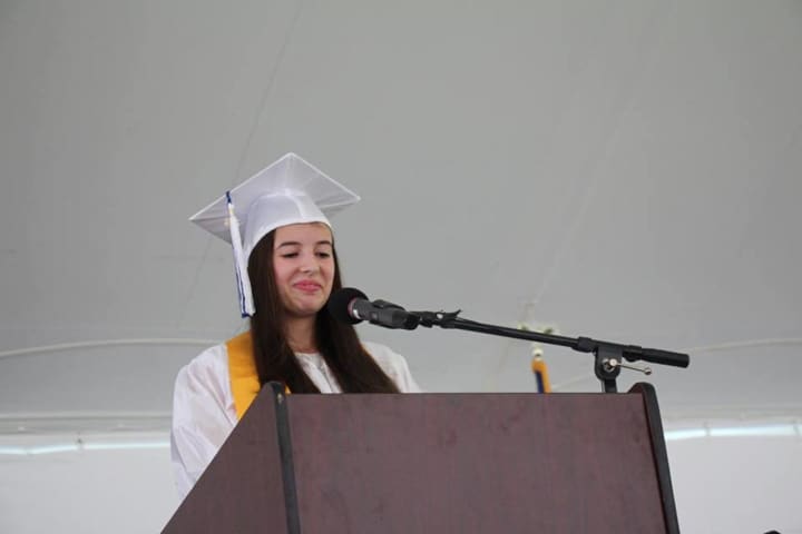 Pelham High School senior Sabina Maggiore reads a speech she wrote called &quot;Azucar&quot; at last month&#x27;s graduation ceremony.