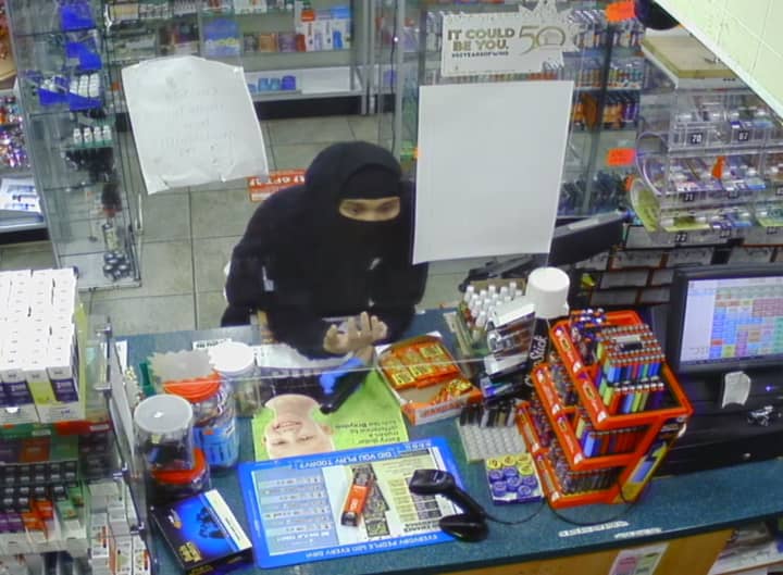 Investigators are searching for a suspect who is accused of robbing a Preston gas station at gunpoint.