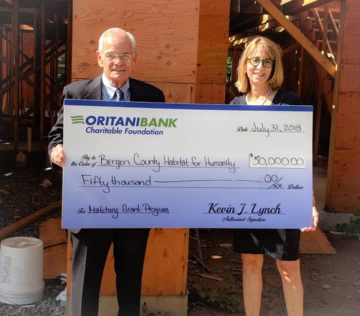 Kevin J. Lynch, president of the OritaniBank Charitable Foundation and chairman, president and CEO of Oritani Bank and Jacey Raimondo, executive director of Habitat for Humanity of Bergen County.