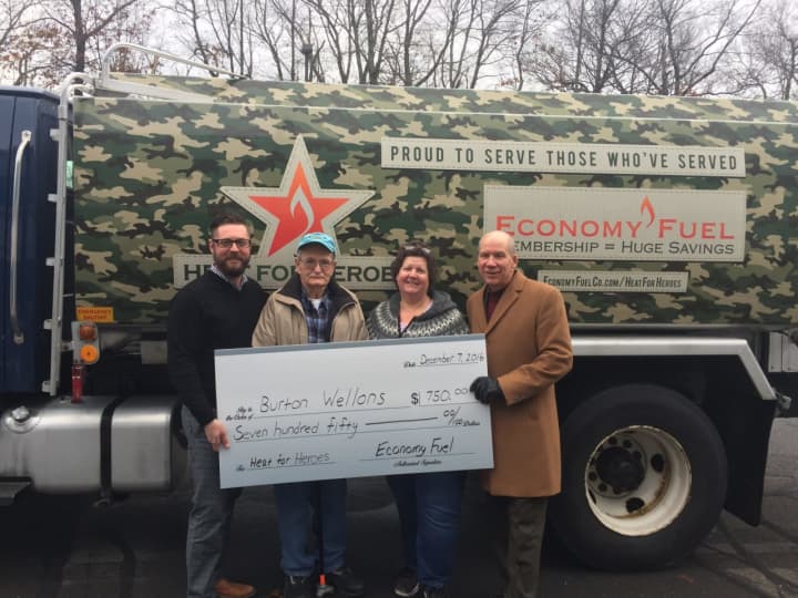 From left, Mike Gill of Economy Fuel, recipient Burton Wellons, Wellons&#x27; daughter Robin Friend and Greater Valley Chamber President Bill Purcell hold Wellons&#x27; check.