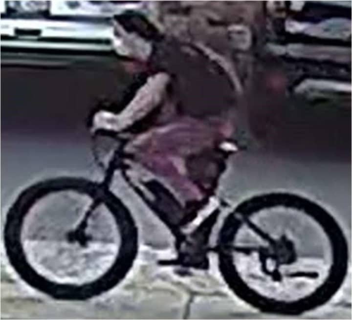 A photo has been released of a man who allegedly exposed himself to a 9-year-old girl riding her bicycle before trying to pull her sister’s pants down, police said.