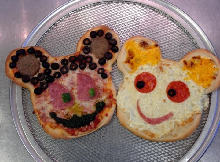 Mickey and Minnie Mouse shaped pies, with their pepperoni eyes and meatball ears, are part of the fun at Pizza One.