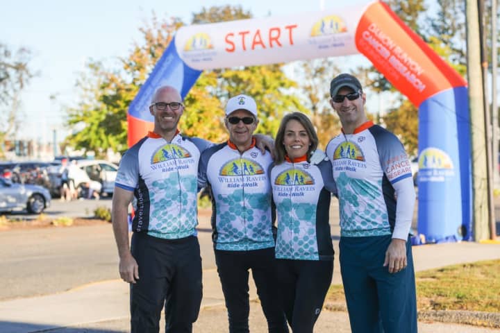 Left  to right: Raveis Co-President Chris Raveis, Founder/ Chairman and CEO Bill Raveis, William Raveis Charitable Fund Managing Director Meghan Raveis, Co-President Ryan Raveis at a William Raveis Ride + Walk event.