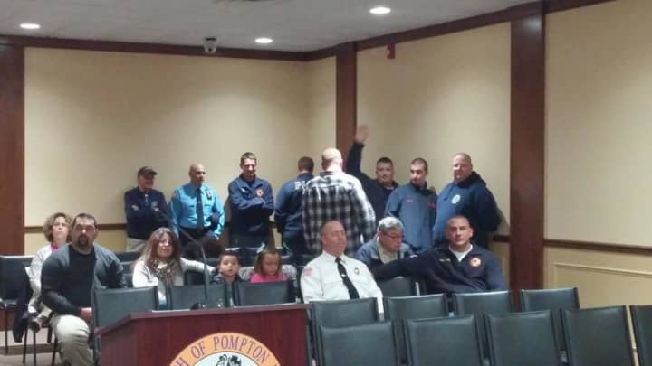 Solis, sitting on the far left next to his family, was sworn in on Wednesday to the Pompton Lakes Voulteer Fire Department.