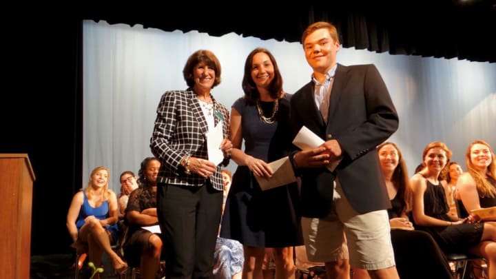 Fairfield Chamber of Commerce President Beverly Balaz, left, and FELO Chair Jackie Kosiba of Delamar Southport, center, present a scholarship to 2017 Fairfield Ludlowe grad Thomas Wyckoff.