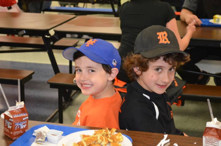 Christopher Bucciero and Owen Zusel enjoy pancakes and chocolate milk at the annual Ridgefield Little League Pancake Breakfast