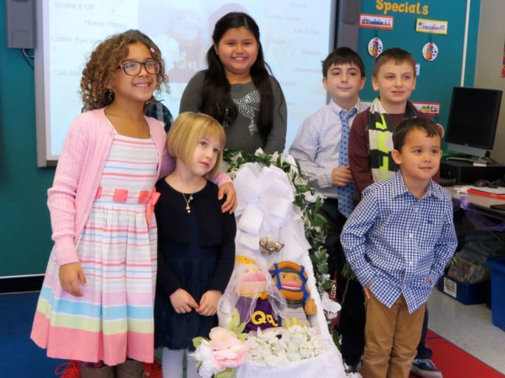 Students at Increase Miller Elementary School in Lewisboro hold a wedding for the letters &quot;Q&quot; and &quot;U.&quot;