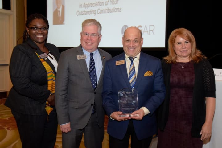 From left, Dorothy Botsoe, president of the Hudson Gateway Association of Realtors with HGAR CEO Richard Haggerty[ Barry Kramer, 2017 HGAR “Realtor of the Year;” and Terri Crozier, HGAR Recognition Committee Chair.