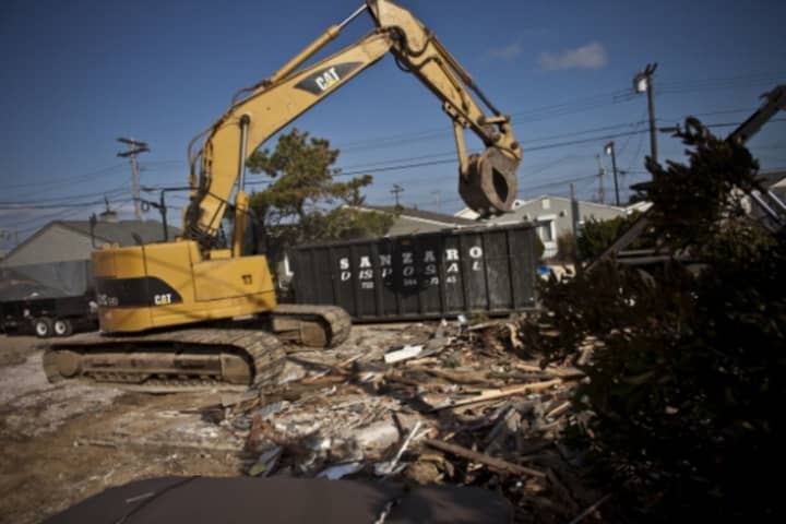 A so-called &quot;zombie&quot; house in Mount Vernon was torn down Sunday, similar to this demolition.